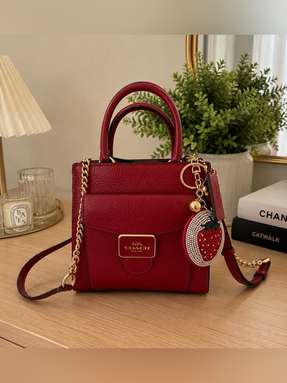 Coach Red Leather Mini Satchel with Strawberry Charm and Gold Hardware.